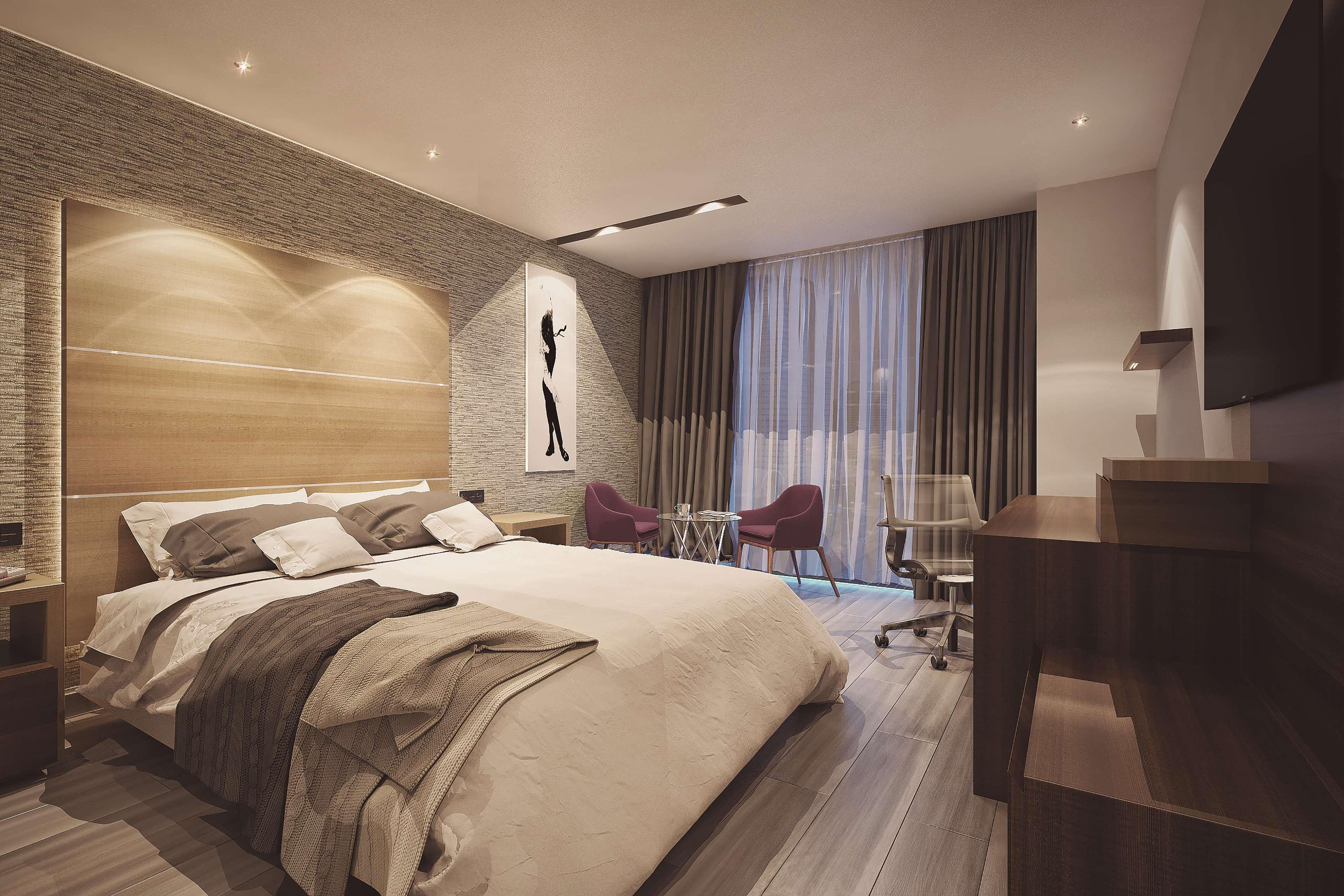 卡米诺里尔蒙特雷时尚大道酒店 San Pedro Garza Garcia 外观 照片 A bedroom